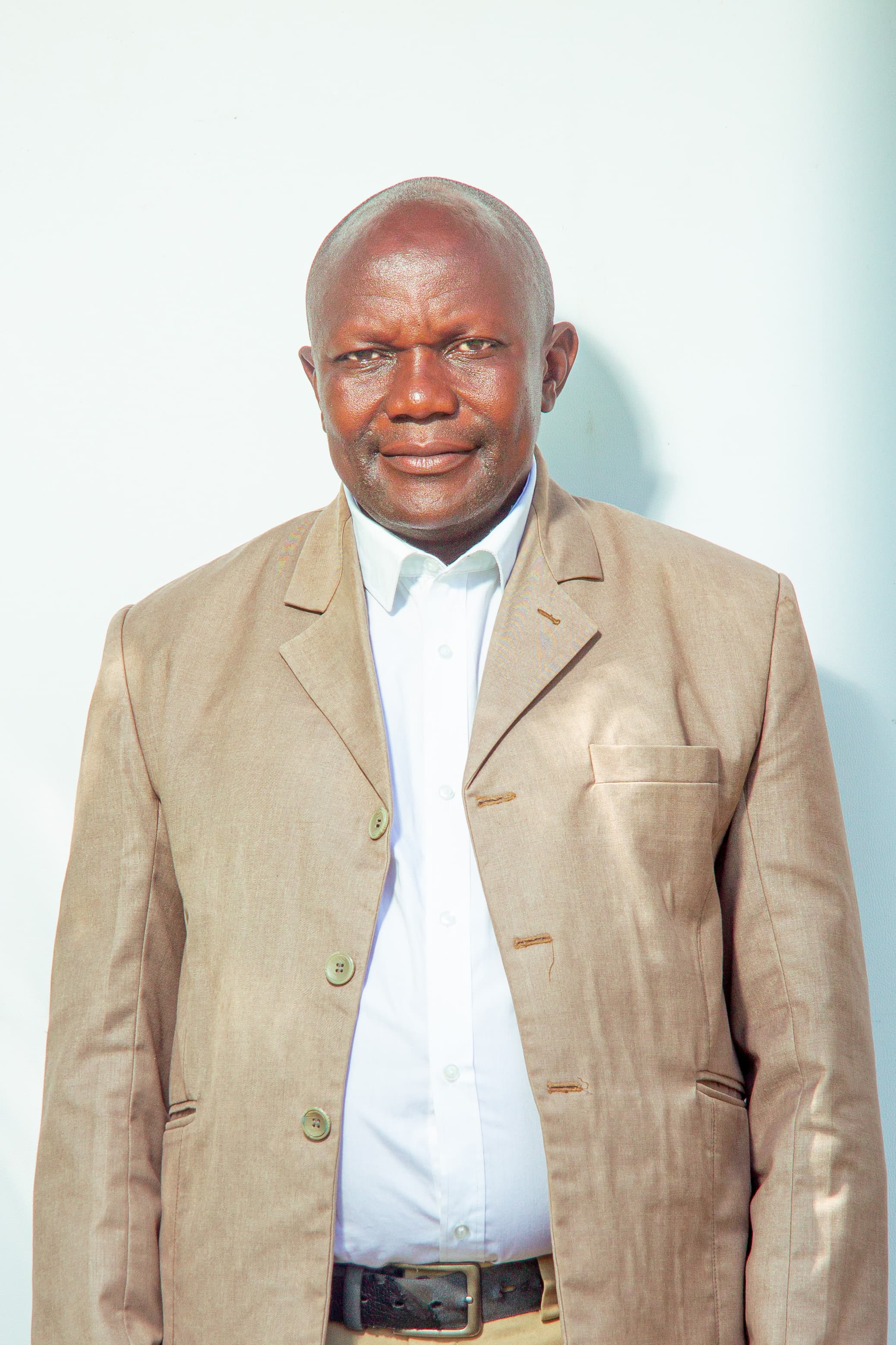 Oweng. Kamero Elasto Komungalo — Minister without Portfolio in the Office of the Prime Minister